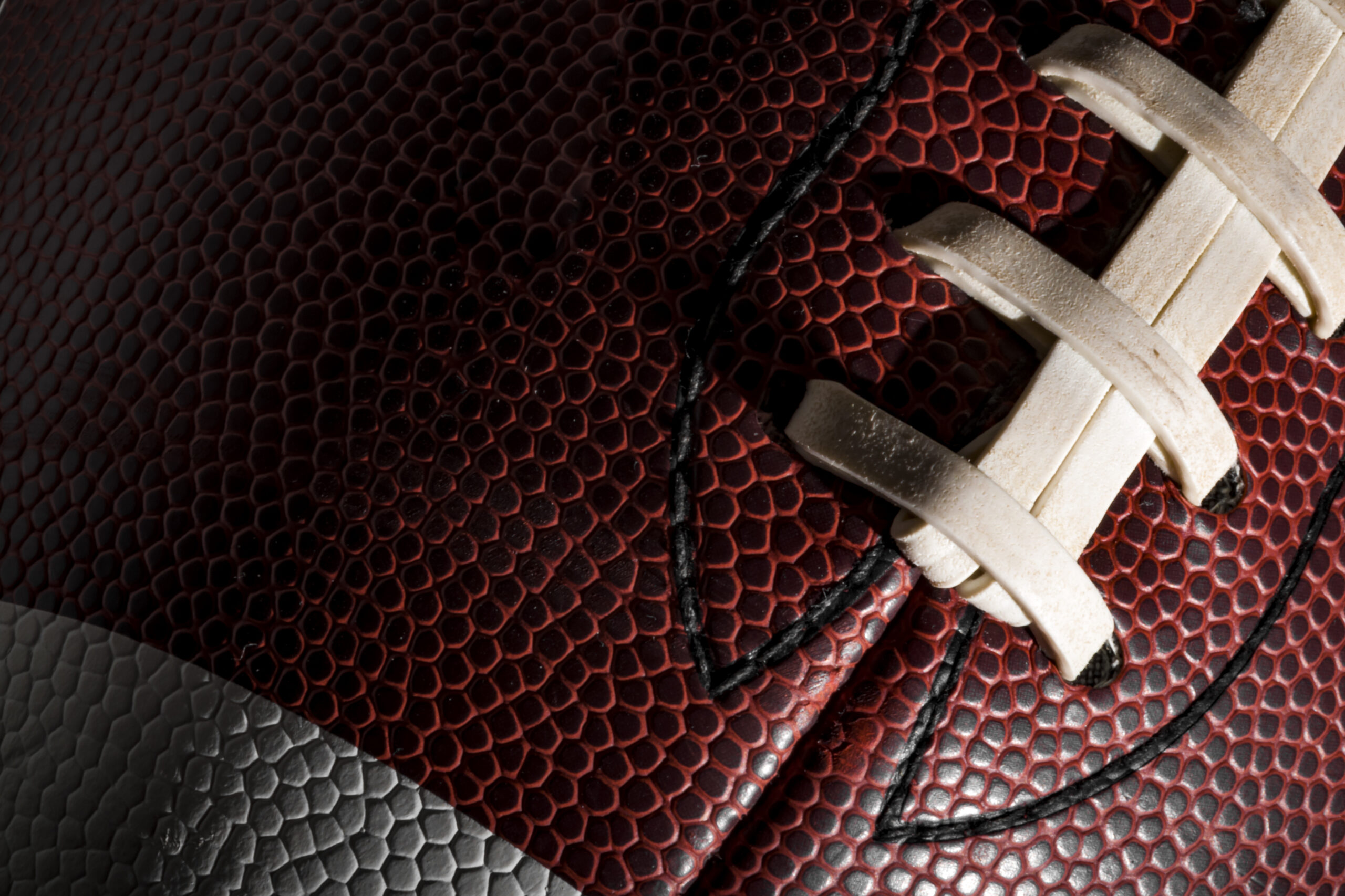 MacroOfAAmericanFootballBallWithVisibleLacesStitches - ESPN The Fan