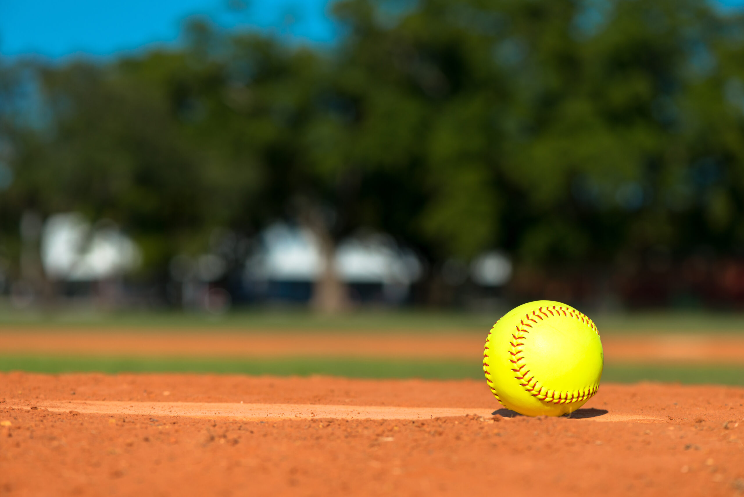 BrightFluorescentNeonYellowSoftballOnPitchersMoundWithField - ESPN The Fan