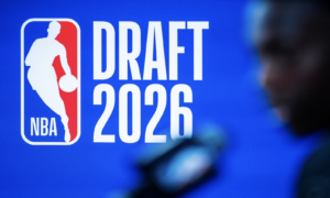 NBA Draft 2026 logo on a blue background with a white silhouette of a basketball player in a dynamic pose.