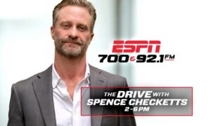 Promotional banner with a man in a gray suit; ESPN 700 & 92.1 FM logo and show info: The Drive with Spence Checketts, 2-6 PM
